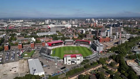 Drone aerial view of Old Trafford Cricket Stadium and city centre Stock Footage 286115242
