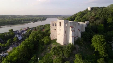 Drone aerial view of the old white Polish castle on the hill near the river in Stock Footage 203959950