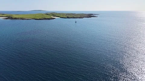 Drone aerial view over the calm Atlantic Ocean at Dog’s Bay, Ireland Stock Footage 343938871