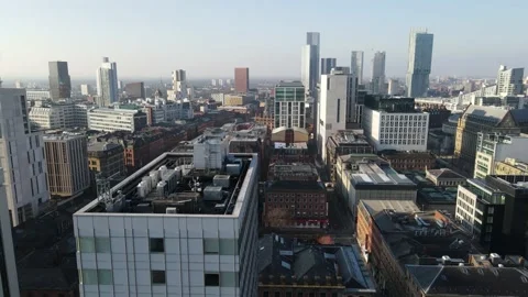 Drone Aerial view overlooking Manchester City Rooftops UK Stock Footage