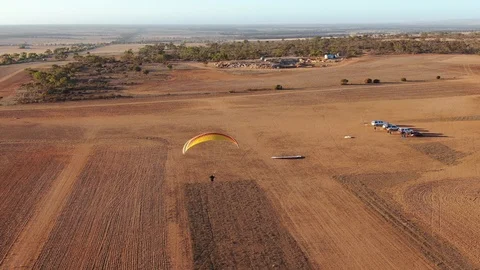 Drone aerial view of paramotor enjoying flying over the wild Granite field Video stock 116565770