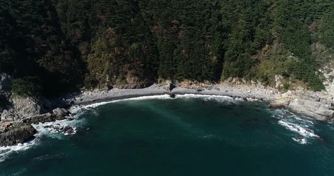 Drone aerial view of pebble beach of Taejongdae scenic spot in Busan Stock Footage 100968126