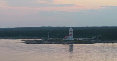 Drone Aerial View of Pointe-des-Monts Lighthouse on Quebec North Shore Stock Footage 327318302