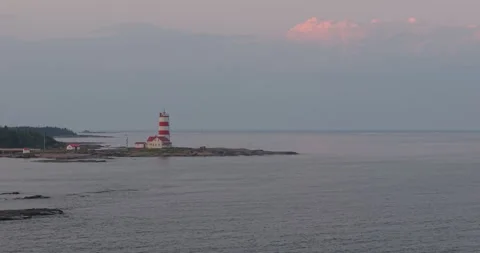 Drone Aerial View of Pointe-des-Monts Lighthouse on Quebec North Shore - 2 Stock Footage 327318330