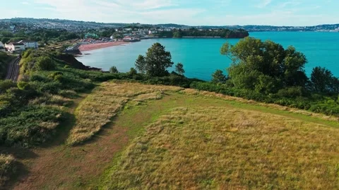 Drone aerial view revealing devon coastline Paignton Torbay, England Stock Footage 338002992