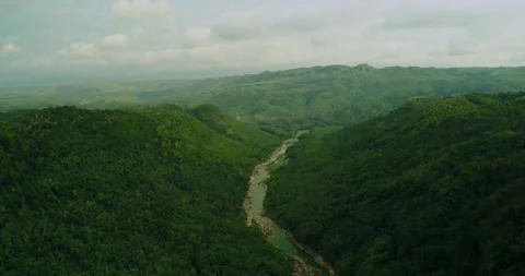 Drone aerial view of river between forest hills Stock Footage 329459948