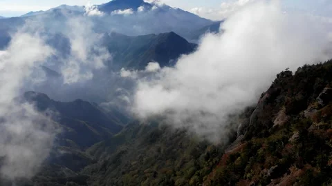 Drone Aerial View of Sea of Clouds and Autumn Foliage in Ishizuchi Mountains Vídeo Stock 344537952