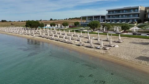 Drone aerial view of seaside hotel and organized beach, summer resort, Greece Stock Footage 327790070