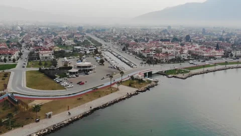 Drone Aerial View Of A Small Town By The Sea In The Mist (Fethiye, Turkey) Stock Footage 194943304
