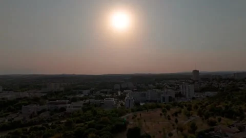 A drone aerial view of the solar eclipse; in the foreground is a field with Stock Footage 344441411