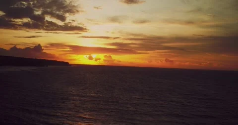 Drone Aerial View of Sunset Light Reflecting Across Tropical Sea Stock Footage 330592044