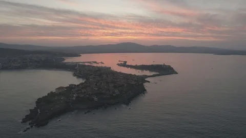 Drone aerial view of sunset on the Sozopol Old town 4k Stockbeeldmateriaal 100128583