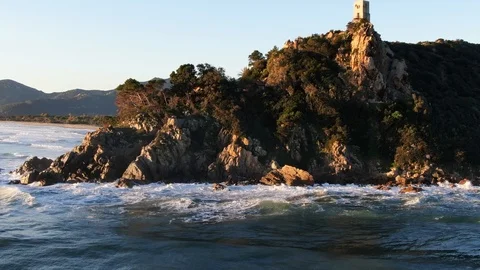 Drone aerial view of Torre Salinas sea promontory at sunrise, Sardinia, Italy Stock Footage 124254836