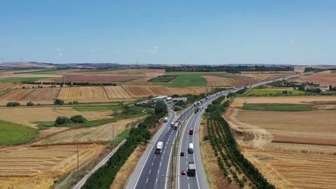 Drone aerial view of vehicles in motion on the highway Stock Footage 150055663