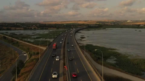 Drone aerial view of vehicles in motion on the highway Stock Footage 150055996