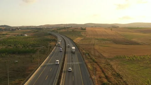 Drone aerial view of vehicles in motion on the highway Stock Footage 150056943