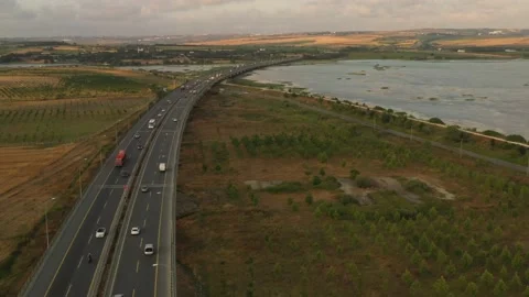 Drone aerial view of vehicles in motion on the highway Stock Footage 150057211