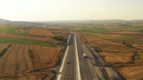 Drone aerial view of vehicles in motion on the highway Stock Footage 150057879