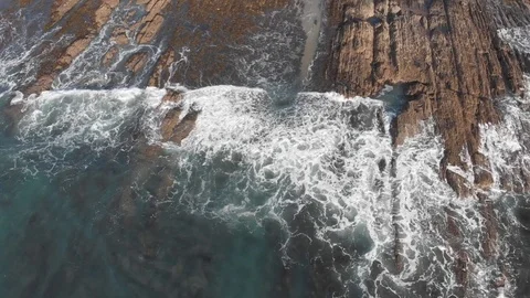 Drone aerial view of waves breaking over rocks Video stock 106425809