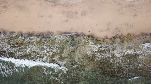 Drone aerial view of waves breaking on sand beach in Porto Santo island Stock Footage 116983327