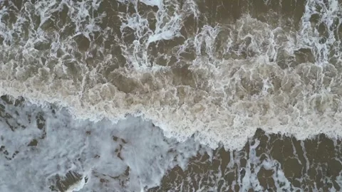 Drone Aerial View of Waves Crashing on an English Beach Stock Footage 296222467