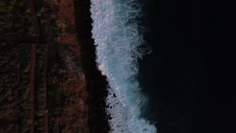 Drone Aerial View of Waves Rolling Towards Shoreline from Above Stock Footage 315099441