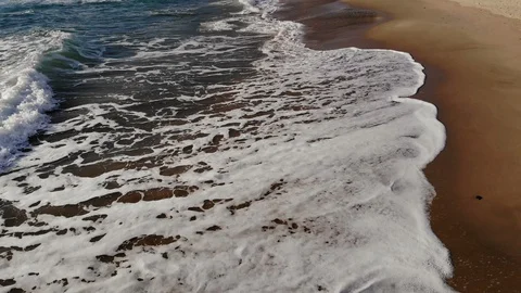 Drone aerial view of waves splashing motion,fly over sandy sea shore,cilento 4k Stock Footage 125597946