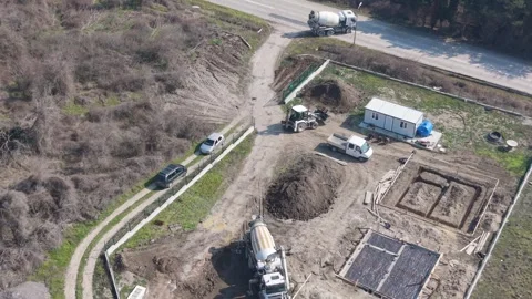 Drone Aerial View Of Workers Pouring Concrete Foundation At Site Stock Footage 330131734