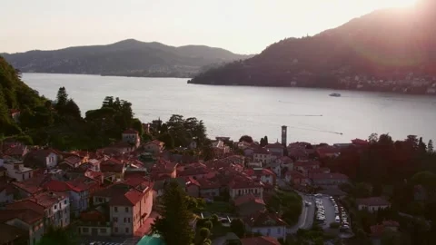 Drone Aerial of Warm Sunset Over Italian Village by the Water Stock Footage 339221558