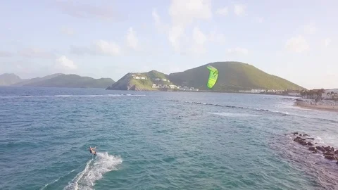 A drone aerial windsurfer rides a wave on the island of St. Kitts in the 库存影片 113687749