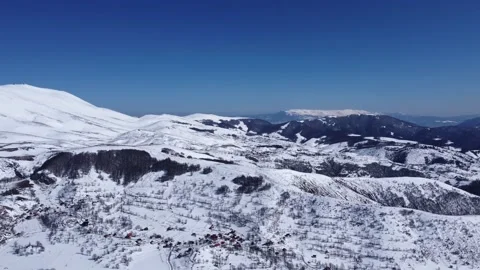 Drone of an amazing panoramic view of a mountain range covered with snow Stock Footage 172022858