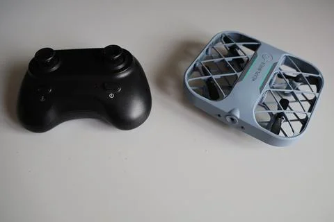 Drone and controller on a table Stock Photos