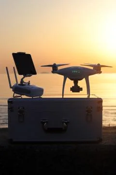 Drone and remote controller in sunset Foto stock