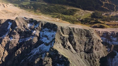 Drone approach from above toward rugged alpine mountain ridge Stock Footage 336333981