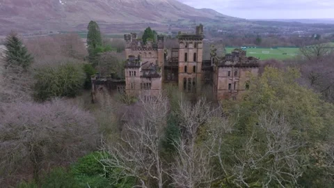 Drone approach and flyover of abandoned Lennox Castle in Scotland 動画素材 308791373