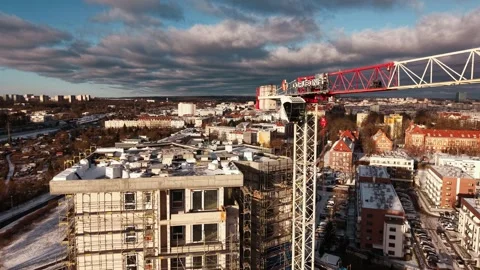Drone approach to crane operator cabin over Szczecin construction Stock Footage 326234299