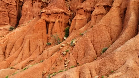 Drone approach to a giant red cliff in Skazka Canyon, Kyrgyzstan. Stock Footage 316826941