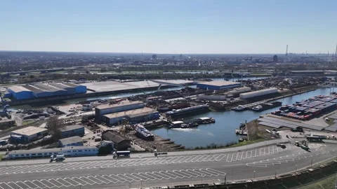 Drone approach over road toward industrial scrapyard Stock Footage 331896813
