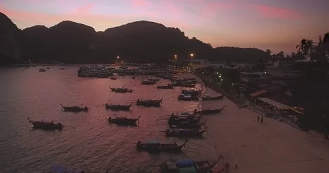 Drone Approach Shot Over Longtail Boats in Phi Phi Islands, Thailand, at Dusk Stock-Footage 76010801