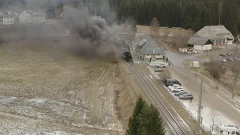 Drone Approach to Steam Train Waiting at Rural Station in Winter Stock-Footage 328045845