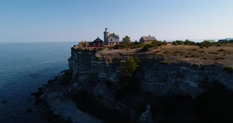 Drone Approach To Stora Karlsö Lighthouse On Cliff Edge Sweden Stock Footage 331552915