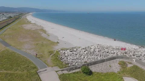 Drone approach toward sandy beach coastline Stock Footage 313453191