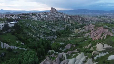 Drone approach Uchisar Castle at dusk Cappadocia Stock Footage 336487411