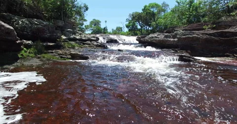 Drone Approach Waterfall over Red Water Vidéo 57284832