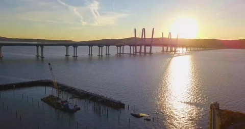Drone approaches bridge at sunset 1 스톡 동영상 296429862