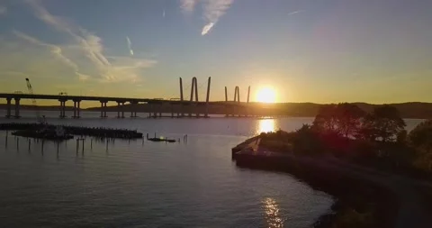Drone approaches bridge at sunset 3 스톡 동영상 296429863