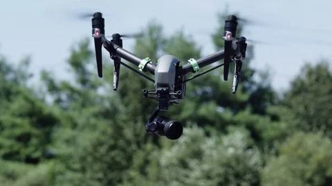 Drone approaches camera.  Trees in background. Stock Footage 80133410