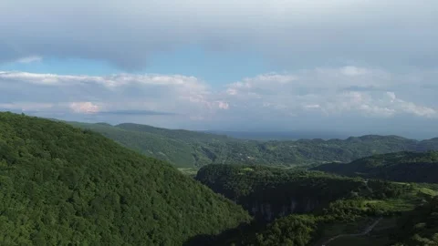 Drone Approaches Canyon Gorge With Mountains, Plain and Villages, Georgia Stock Footage 339355686