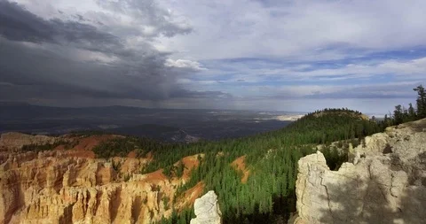 Drone approaches a cloud above a canyon covered with pine trees Vídeo Stock 118642927