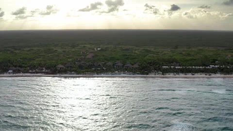 Drone approaches luxury Tulum resort at sunset Stock Footage 294627305